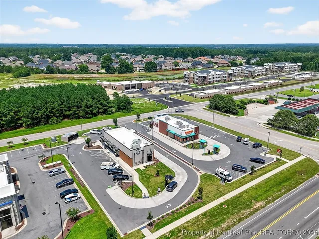 an aerial view of a dining space with furniture