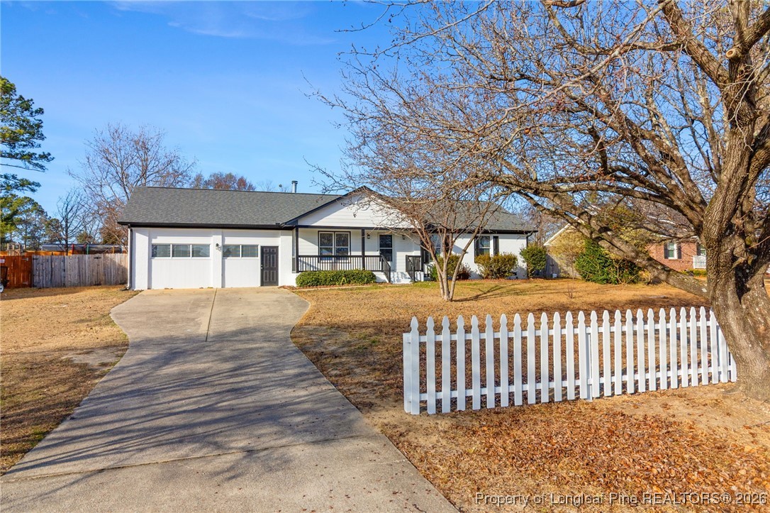 6250 Waldos Beach Road Fayetteville, NC 28306 - Photo 7 of 50 a front view of a house with a garden