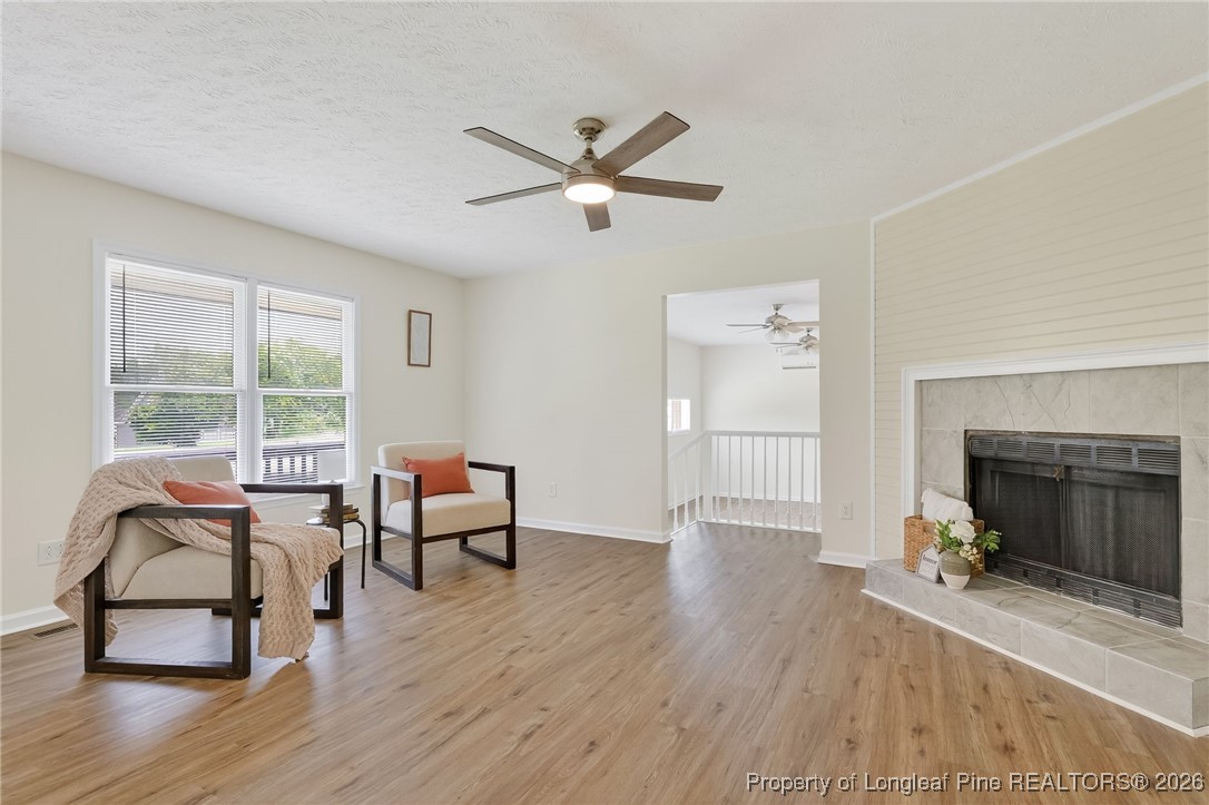 6250 Waldos Beach Road Fayetteville, NC 28306 - Photo 9 of 50 a living room with furniture and a fireplace