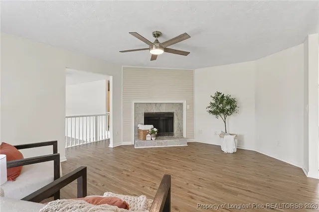 a view of an empty room with a fireplace