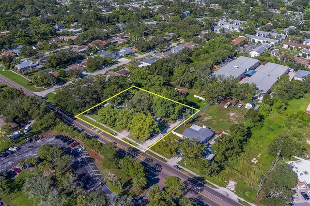 an aerial view of residential house with outdoor space and swimming pool