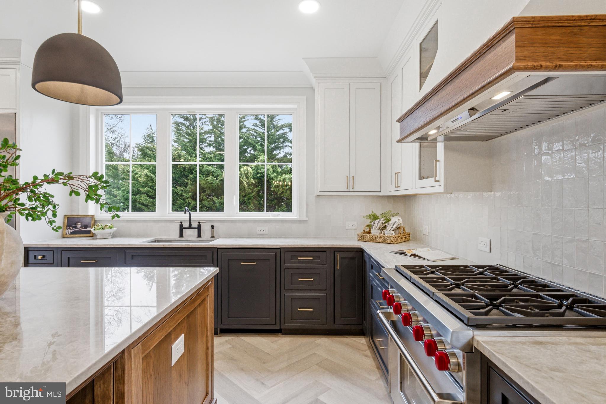 108 Avondale Avenue Haddonfield, NJ 08033 - Photo 20 of 65 a kitchen with stainless steel appliances granite countertop a sink a stove and a window
