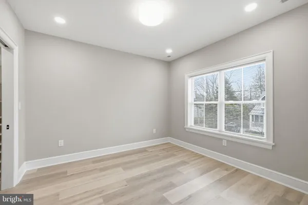 a view of a room with wooden walls