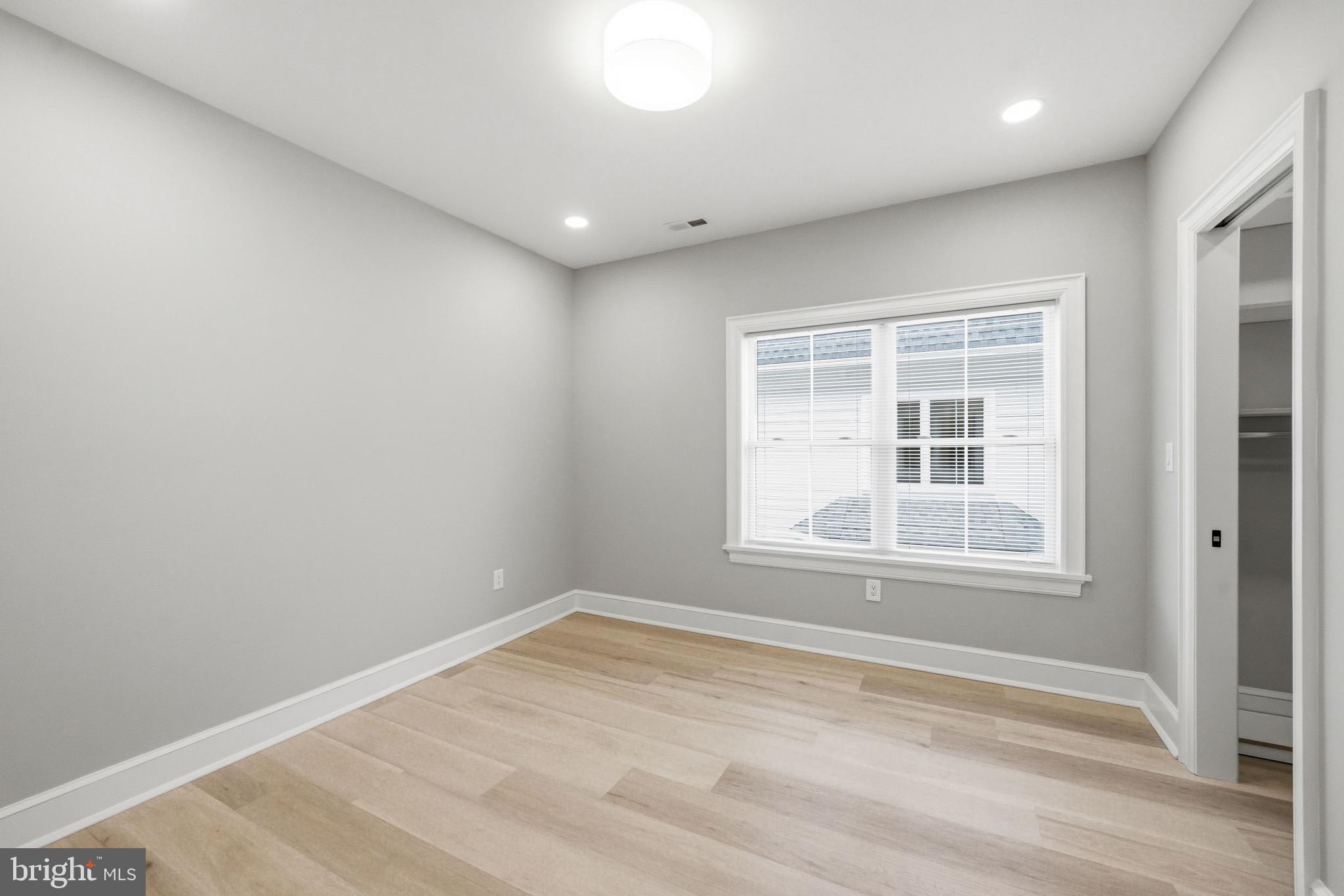 108 Avondale Avenue Haddonfield, NJ 08033 - Photo 48 of 65 an empty room with wooden floor and windows