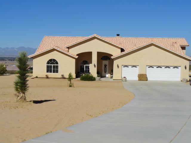 23880 S Road Apple Valley, CA 92307 - Photo 1 of 1 a view of a house with a yard