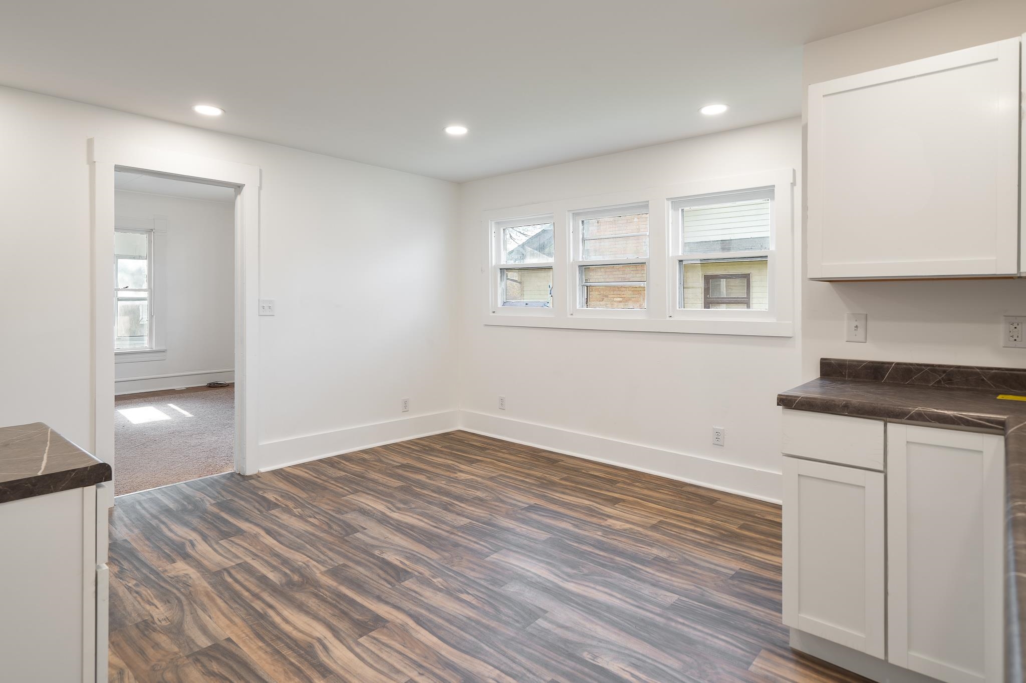 506 South 4th Street Oregon, IL 61061 - Photo 16 of 45 a view of empty room with wooden floor and fan