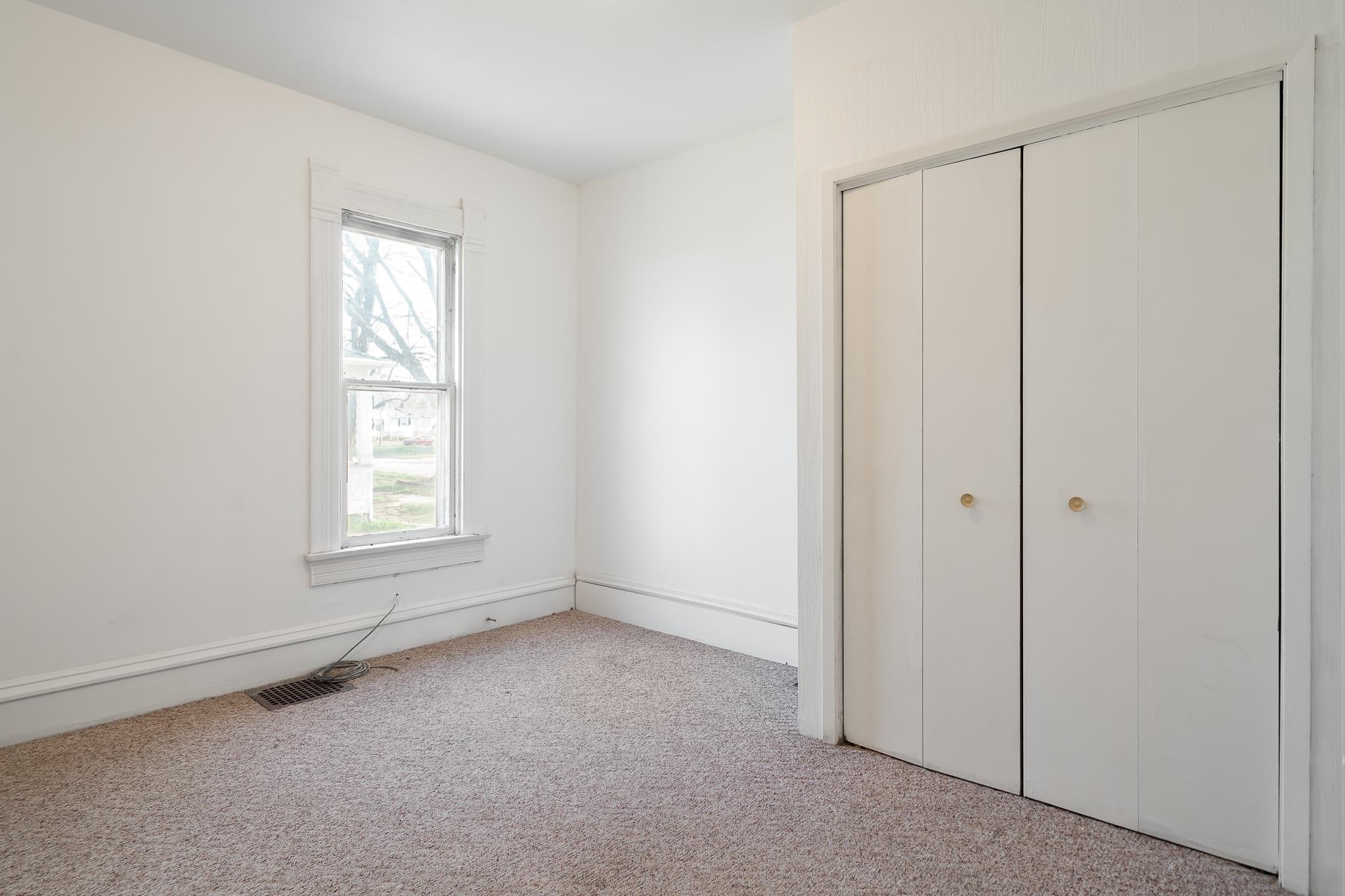 506 South 4th Street Oregon, IL 61061 - Photo 21 of 45 an empty room with windows and closet