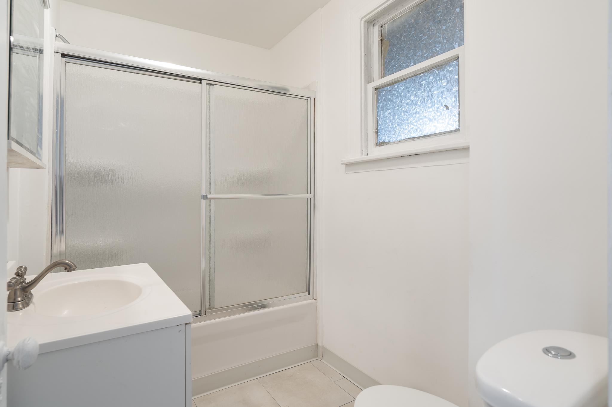 506 South 4th Street Oregon, IL 61061 - Photo 22 of 45 a bathroom with a sink toilet and shower