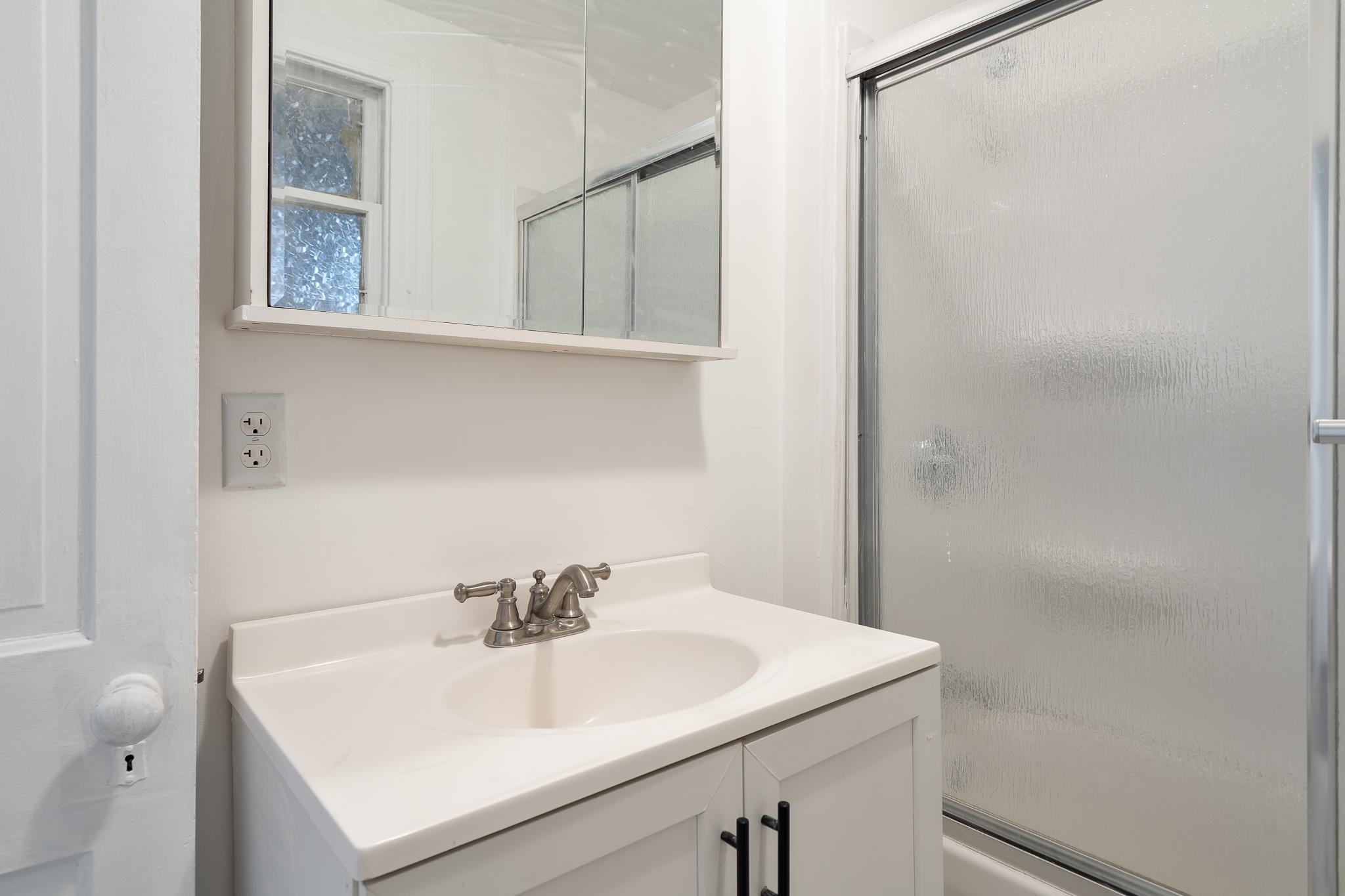 506 South 4th Street Oregon, IL 61061 - Photo 23 of 45 a bathroom with a sink and a mirror