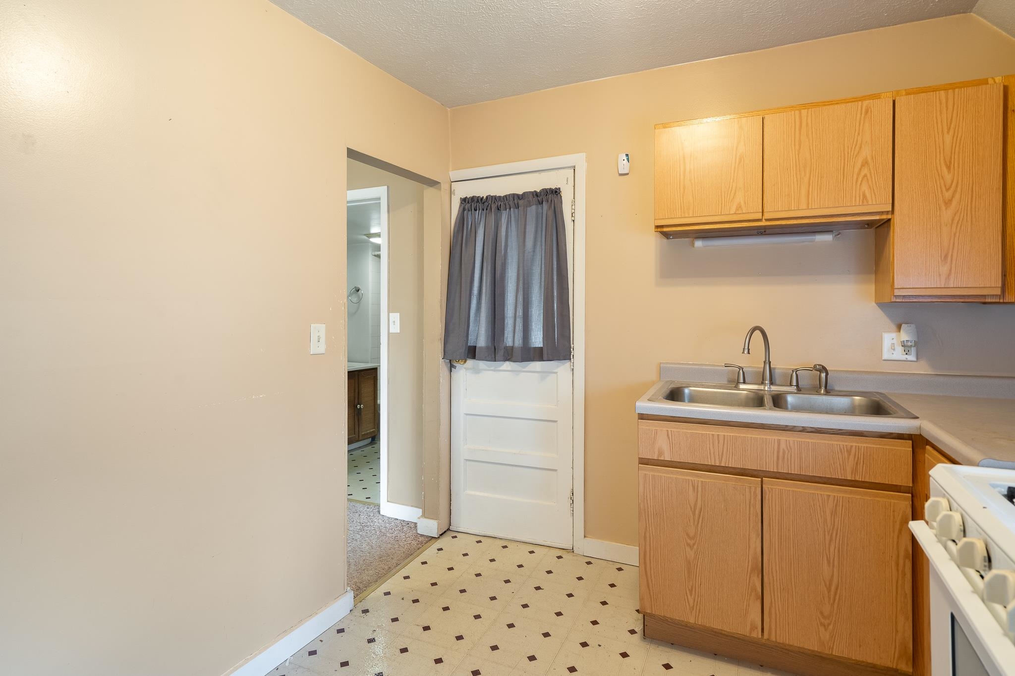 506 South 4th Street Oregon, IL 61061 - Photo 34 of 45 a kitchen with a sink and cabinets