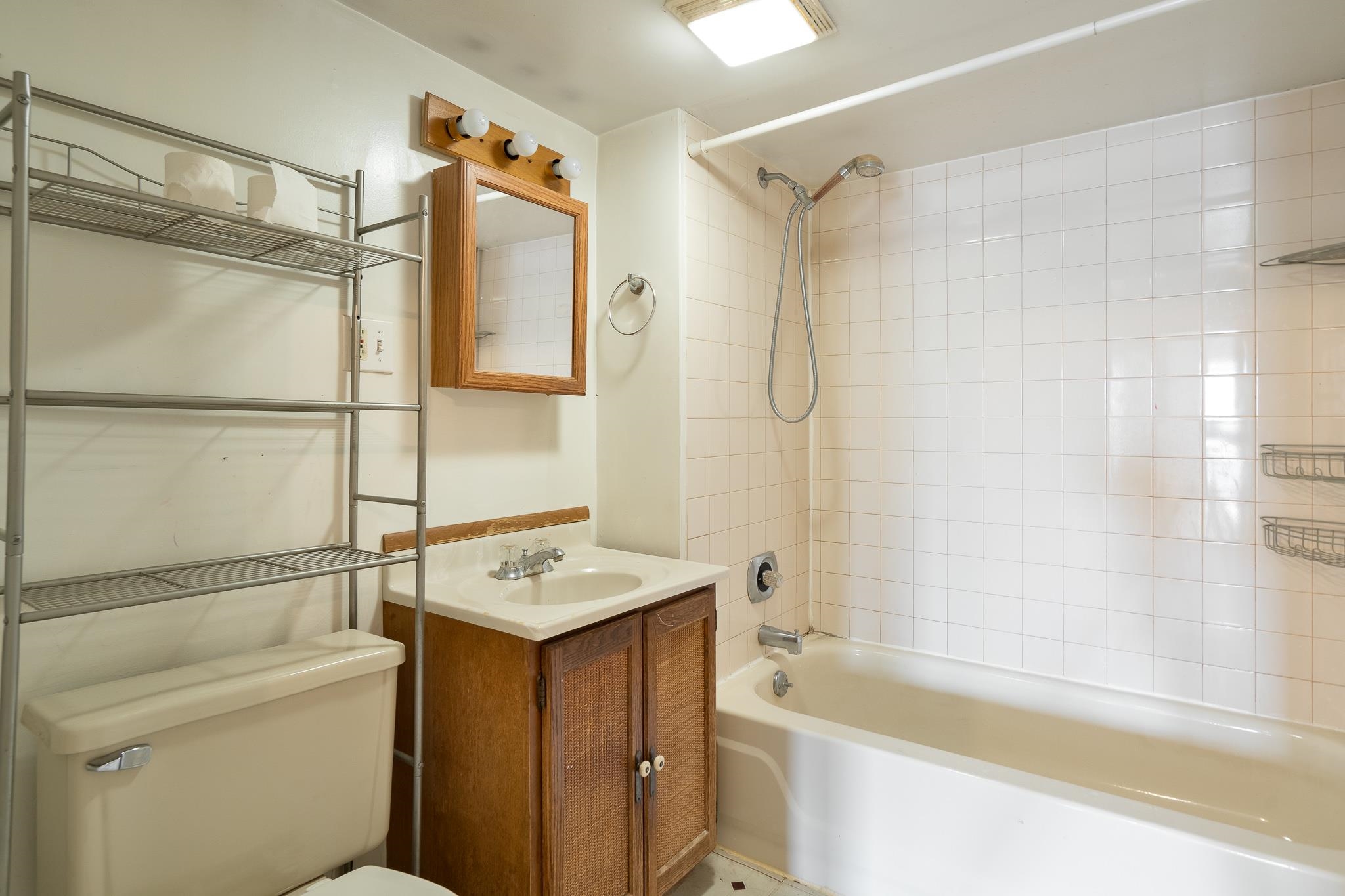 506 South 4th Street Oregon, IL 61061 - Photo 35 of 45 a bathroom with a sink toilet vanity and shower
