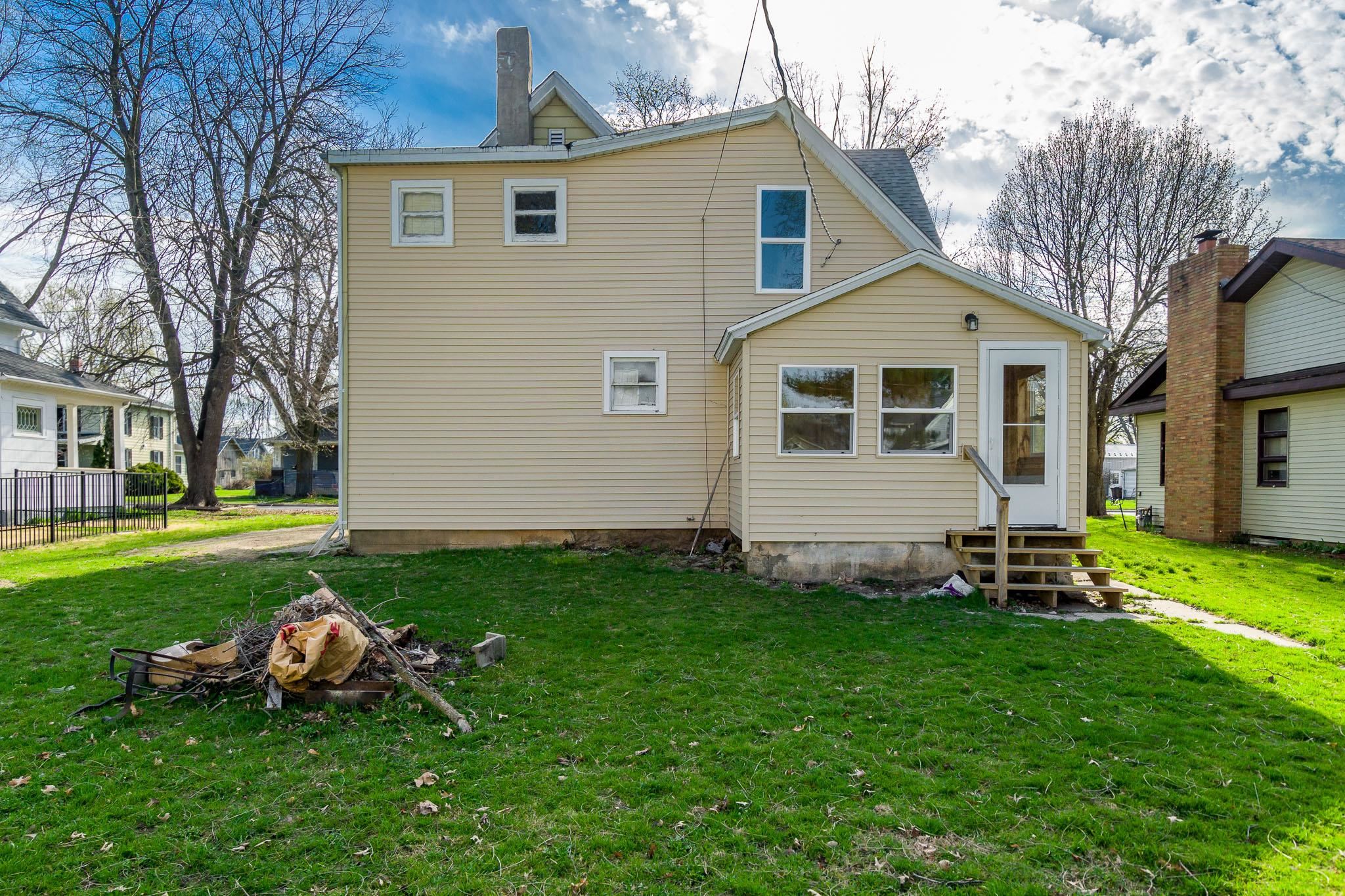 506 South 4th Street Oregon, IL 61061 - Photo 5 of 45 a front view of a house with a yard and outdoor seating