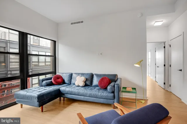 a bedroom with a large bed and a large window