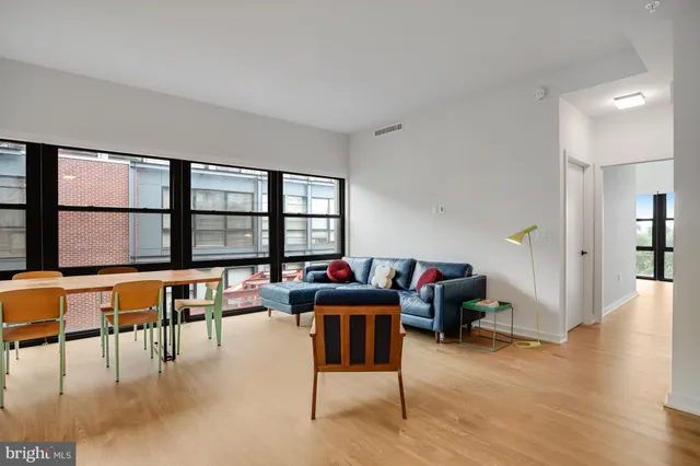 a bedroom with a large bed and a large window