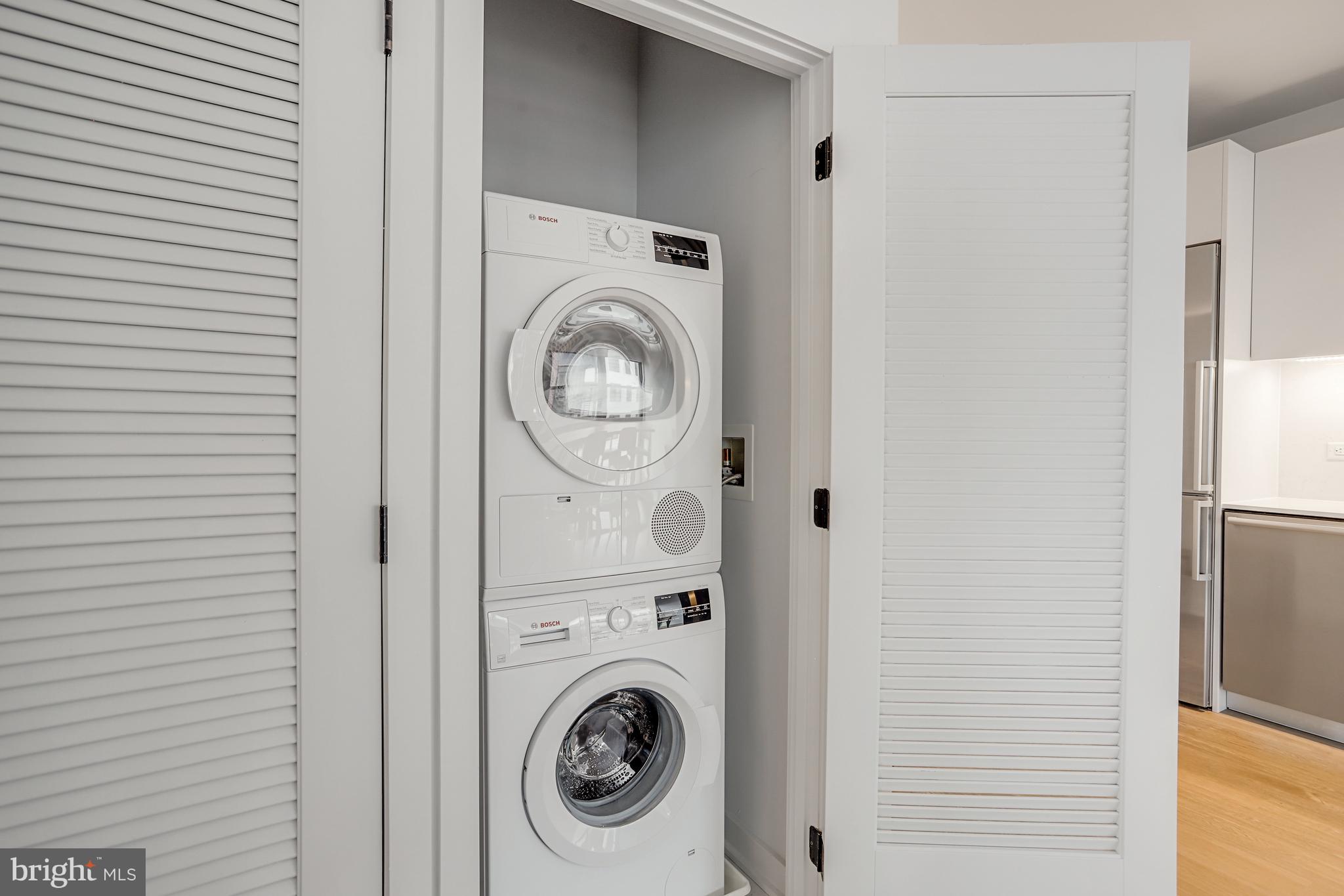 1625 Eckington Place Northeast, Unit 604 Washington, DC 20002 - Photo 31 of 68 a utility room with dryer and washer