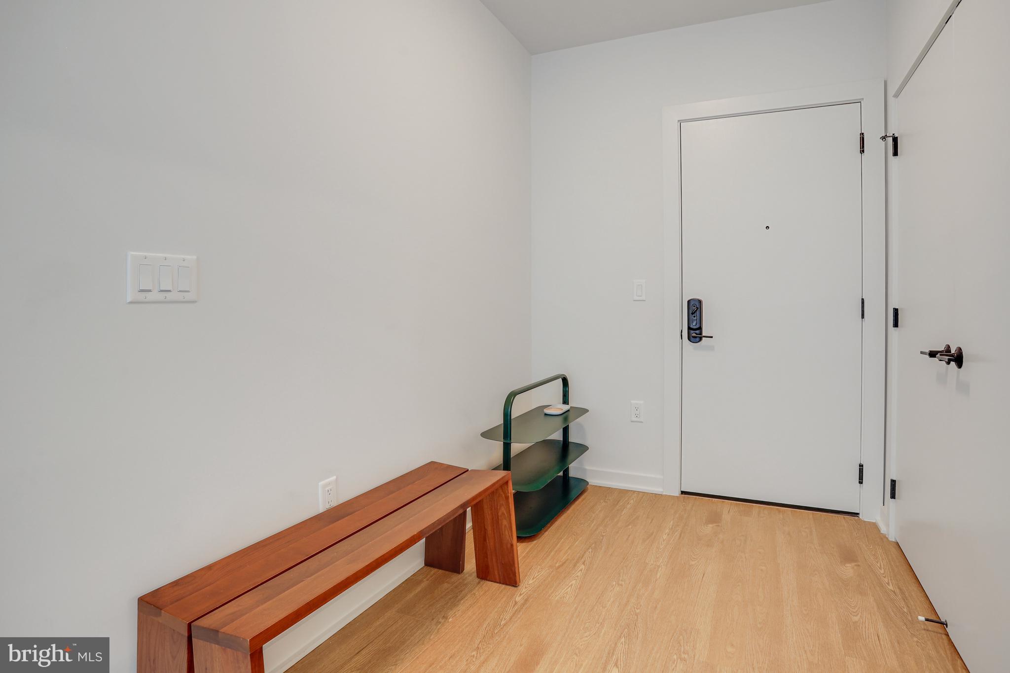 1625 Eckington Place Northeast, Unit 604 Washington, DC 20002 - Photo 33 of 68 a room with a bed and a table