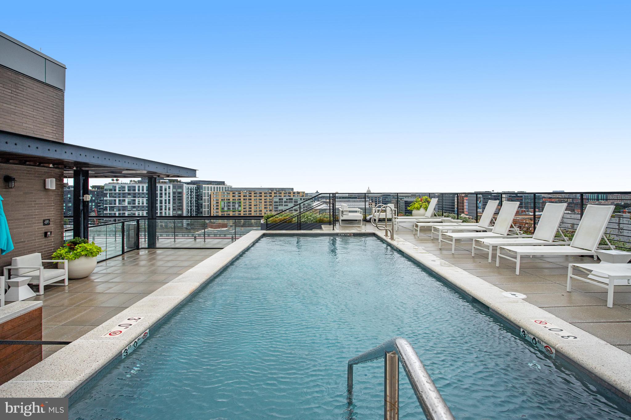 1625 Eckington Place Northeast, Unit 604 Washington, DC 20002 - Photo 37 of 68 a view of swimming pool with a lounge chair