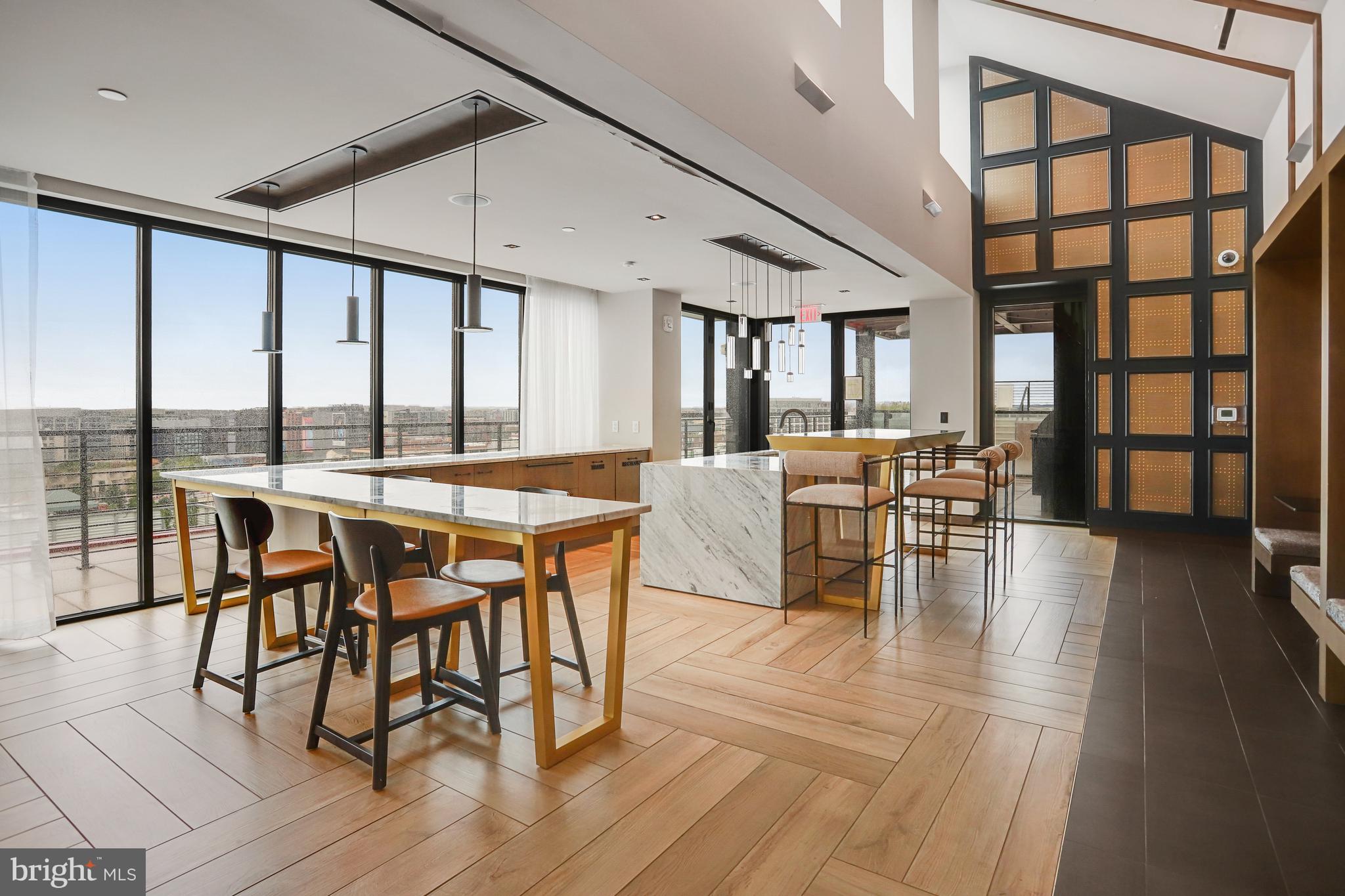 1625 Eckington Place Northeast, Unit 604 Washington, DC 20002 - Photo 47 of 68 a view of a dining room with furniture window and wooden floor
