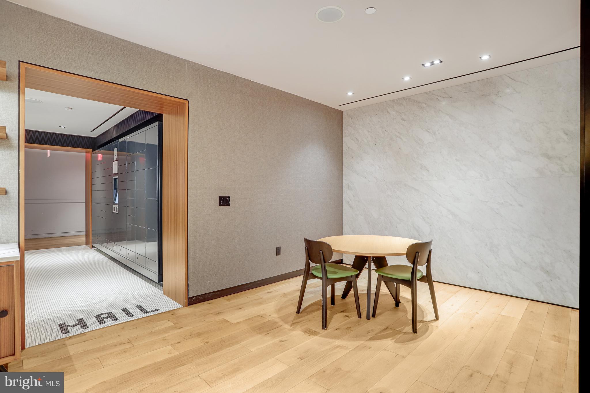 1625 Eckington Place Northeast, Unit 604 Washington, DC 20002 - Photo 57 of 68 a view of a room with a table and chairs