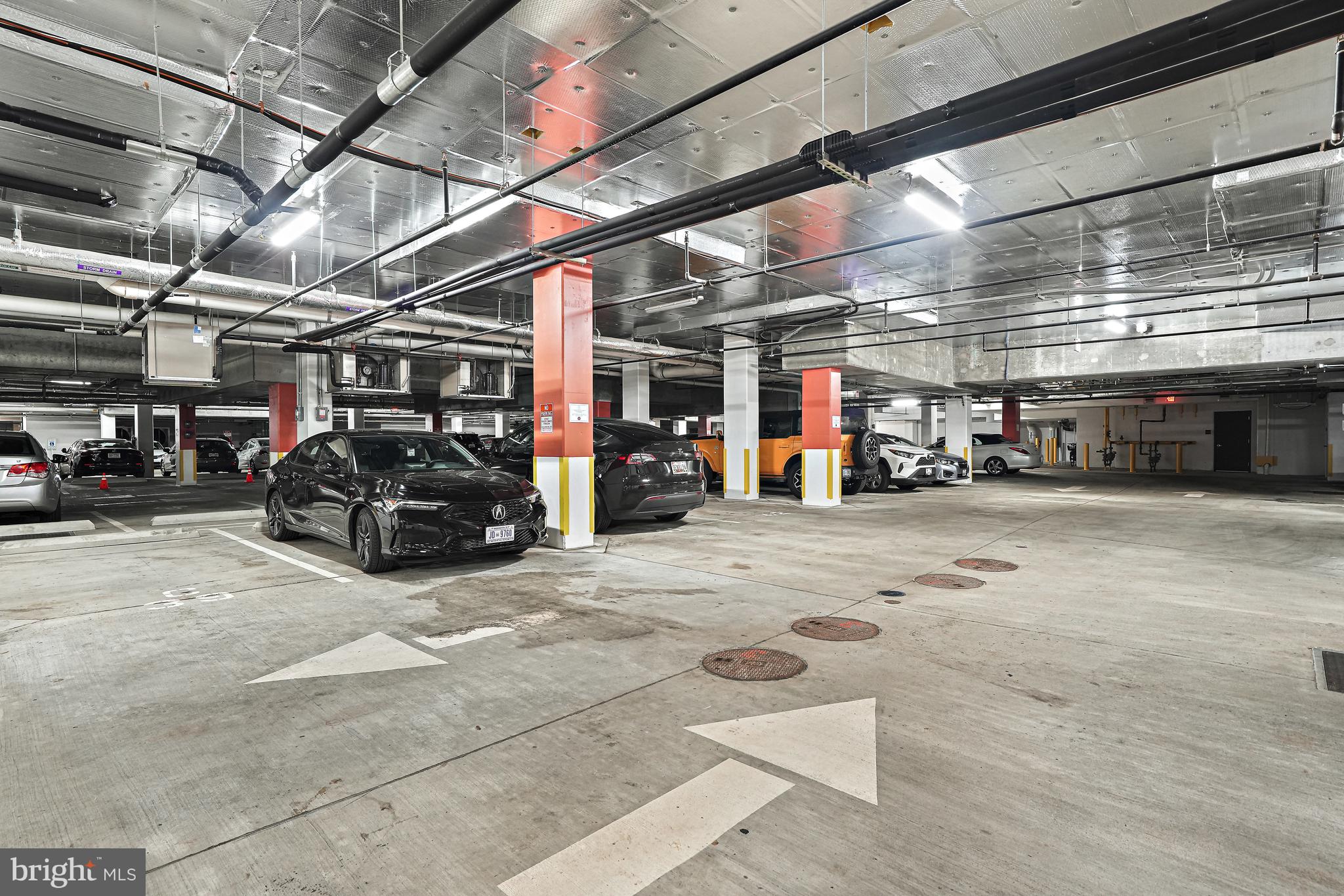 1625 Eckington Place Northeast, Unit 604 Washington, DC 20002 - Photo 62 of 68 a view of parking garage with cars