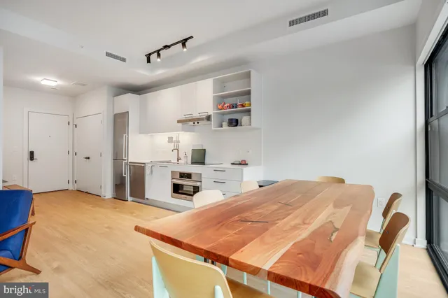 a bed room with a bed and a chair