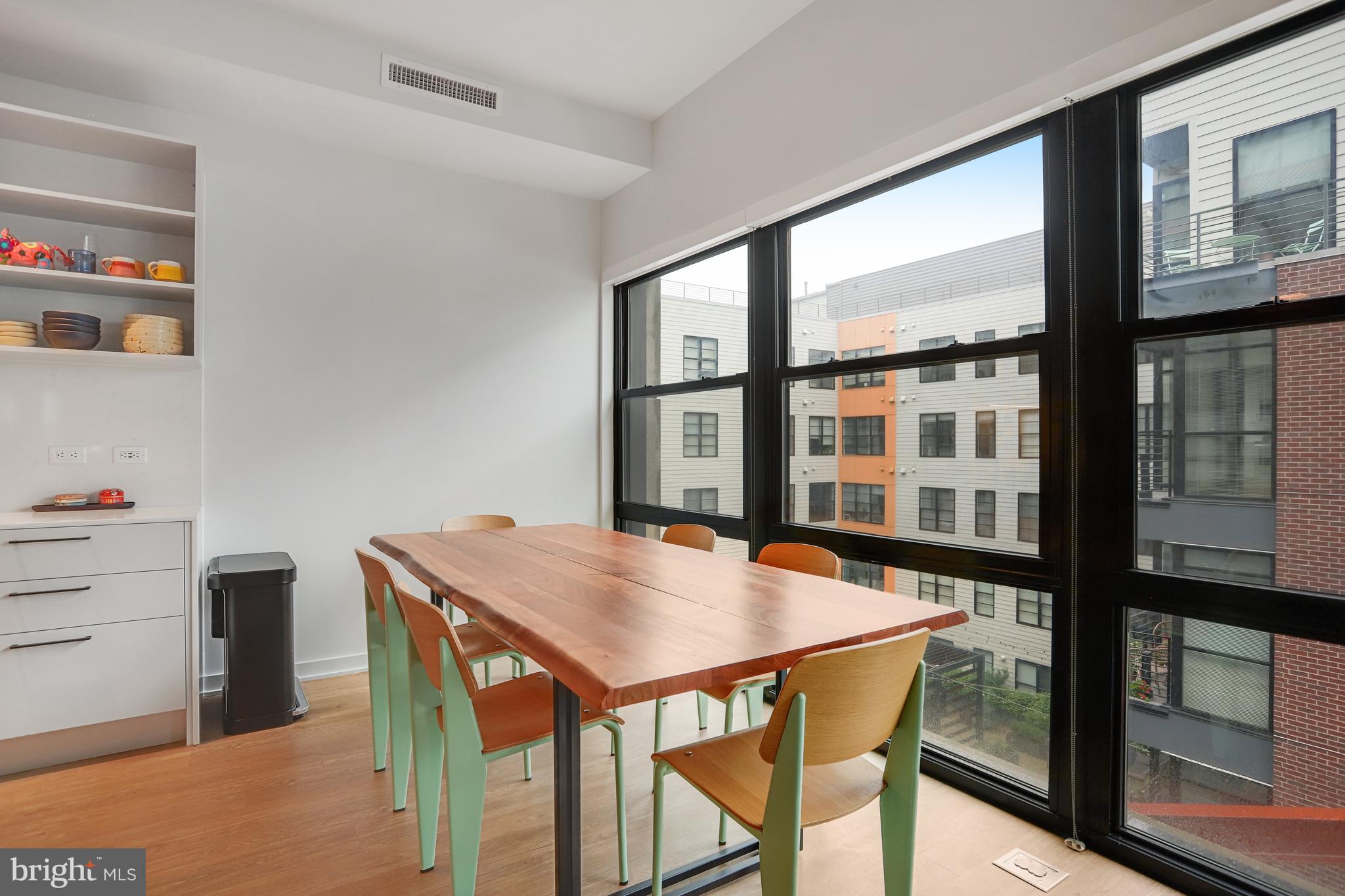 1625 Eckington Place Northeast, Unit 604 Washington, DC 20002 - Photo 10 of 68 a view of a dining table and chairs in a room
