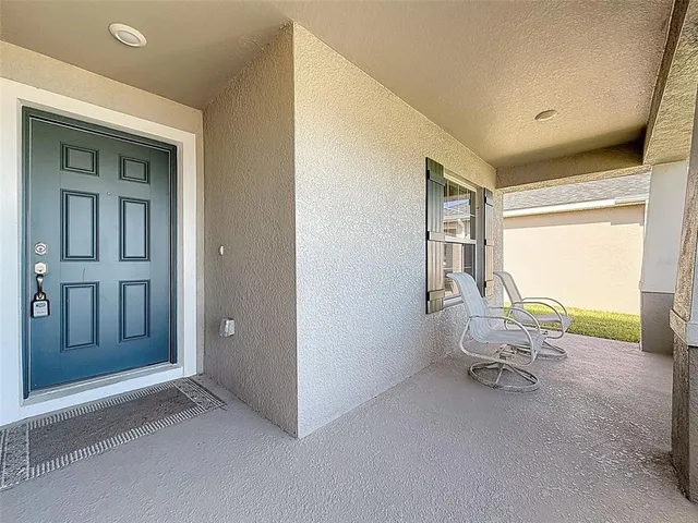 a room with furniture and a window