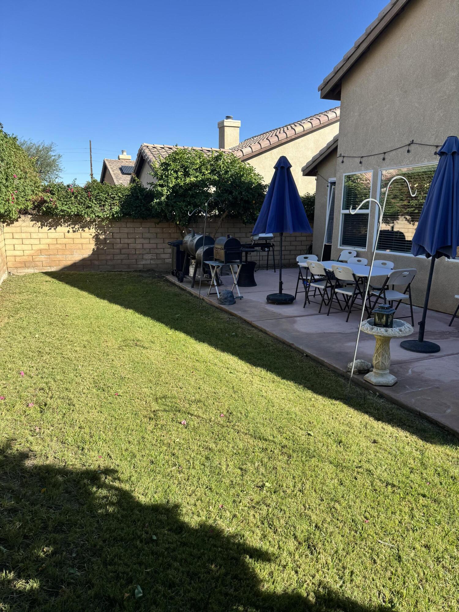 82774 Matthau Drive Indio, CA 92201 - Photo 11 of 44 a view of swimming pool with outdoor seating