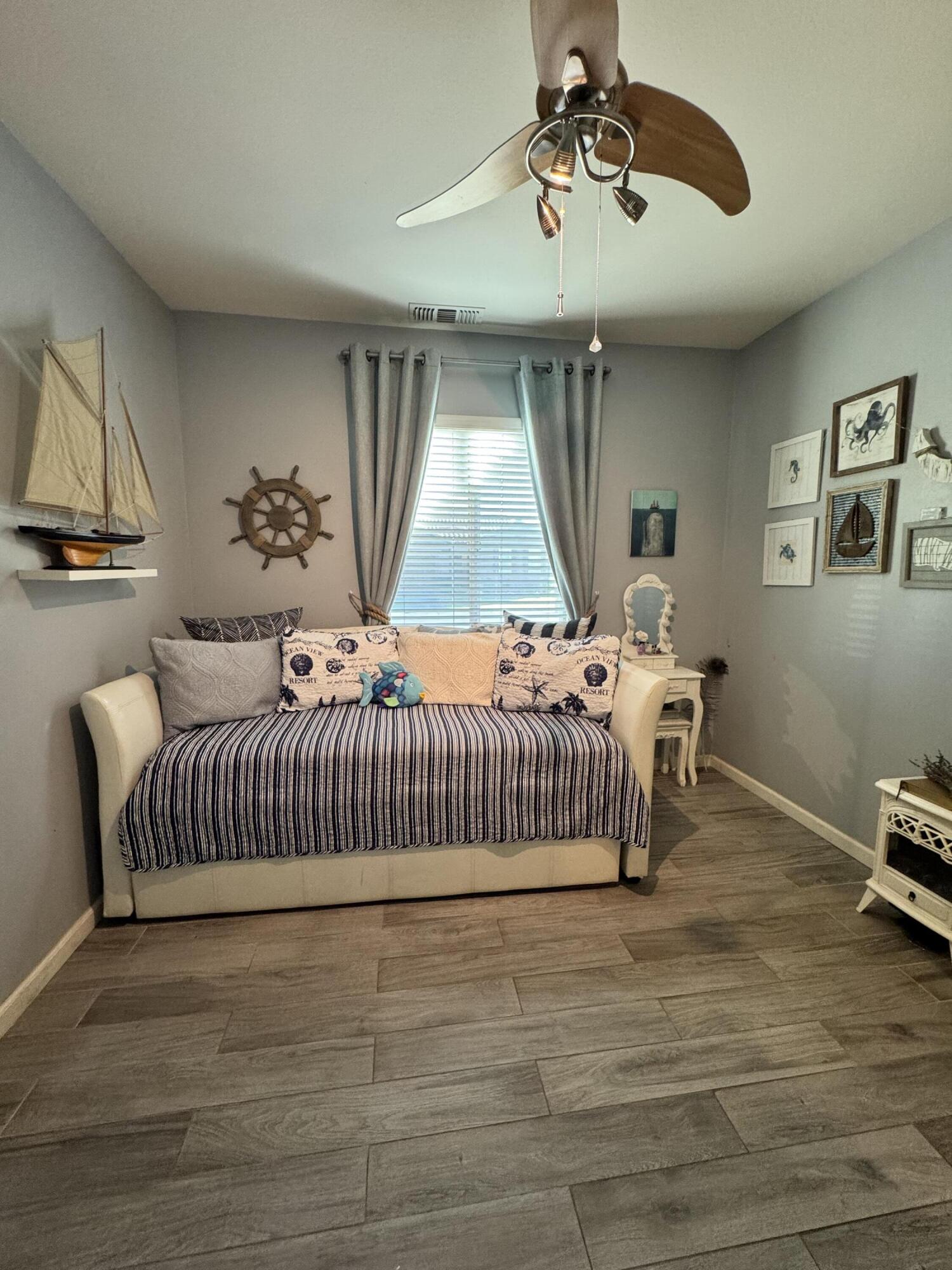 82774 Matthau Drive Indio, CA 92201 - Photo 18 of 44 a bedroom with a bed and window