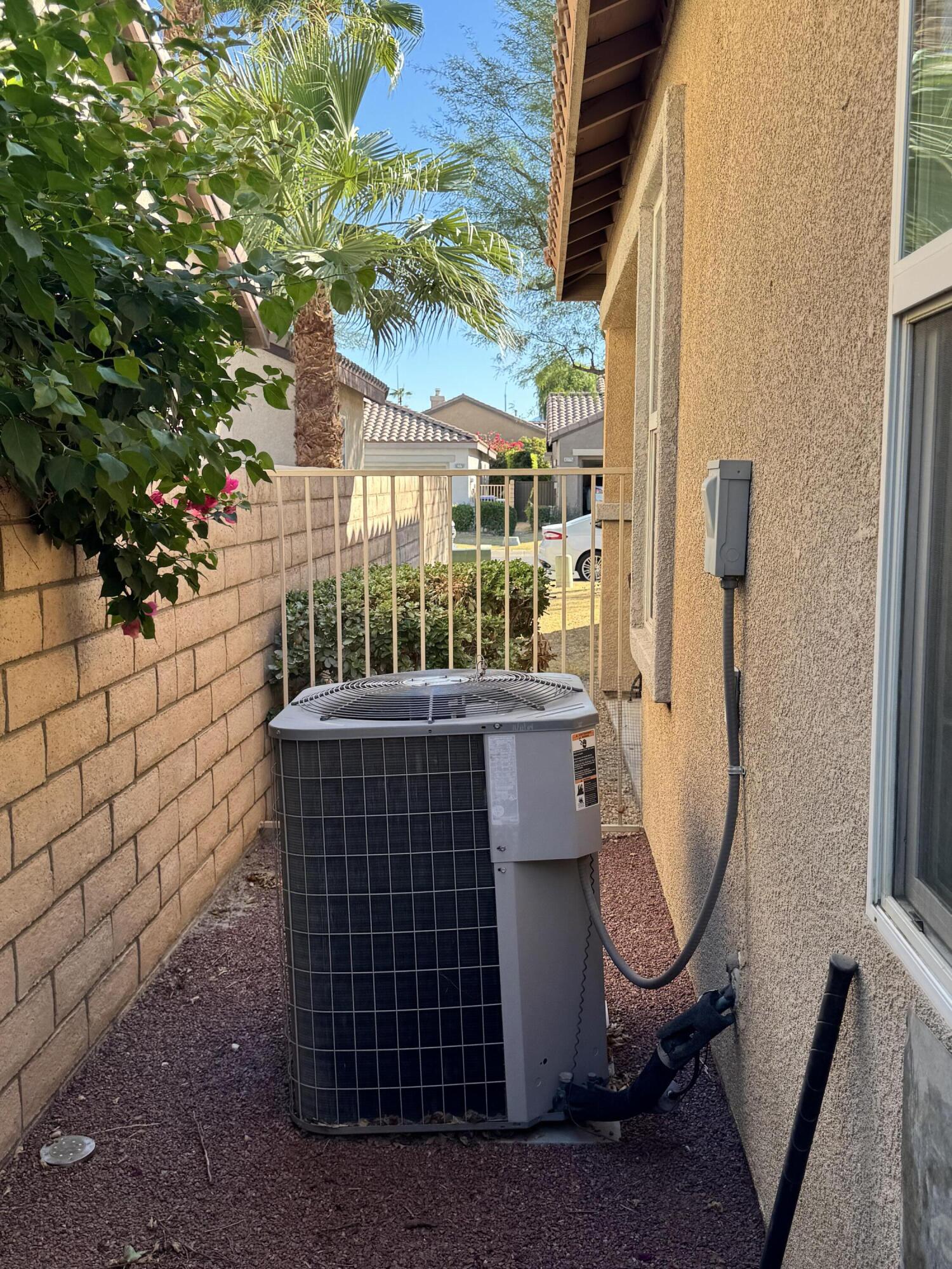 82774 Matthau Drive Indio, CA 92201 - Photo 6 of 44 a view of a chair with a flower pot