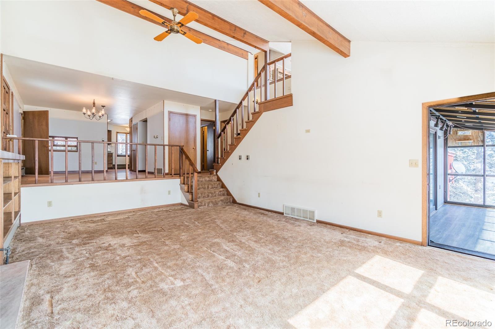 1189 Aspen Drive Evergreen, CO 80439 - Photo 13 of 37 a view of an empty room with wooden floor