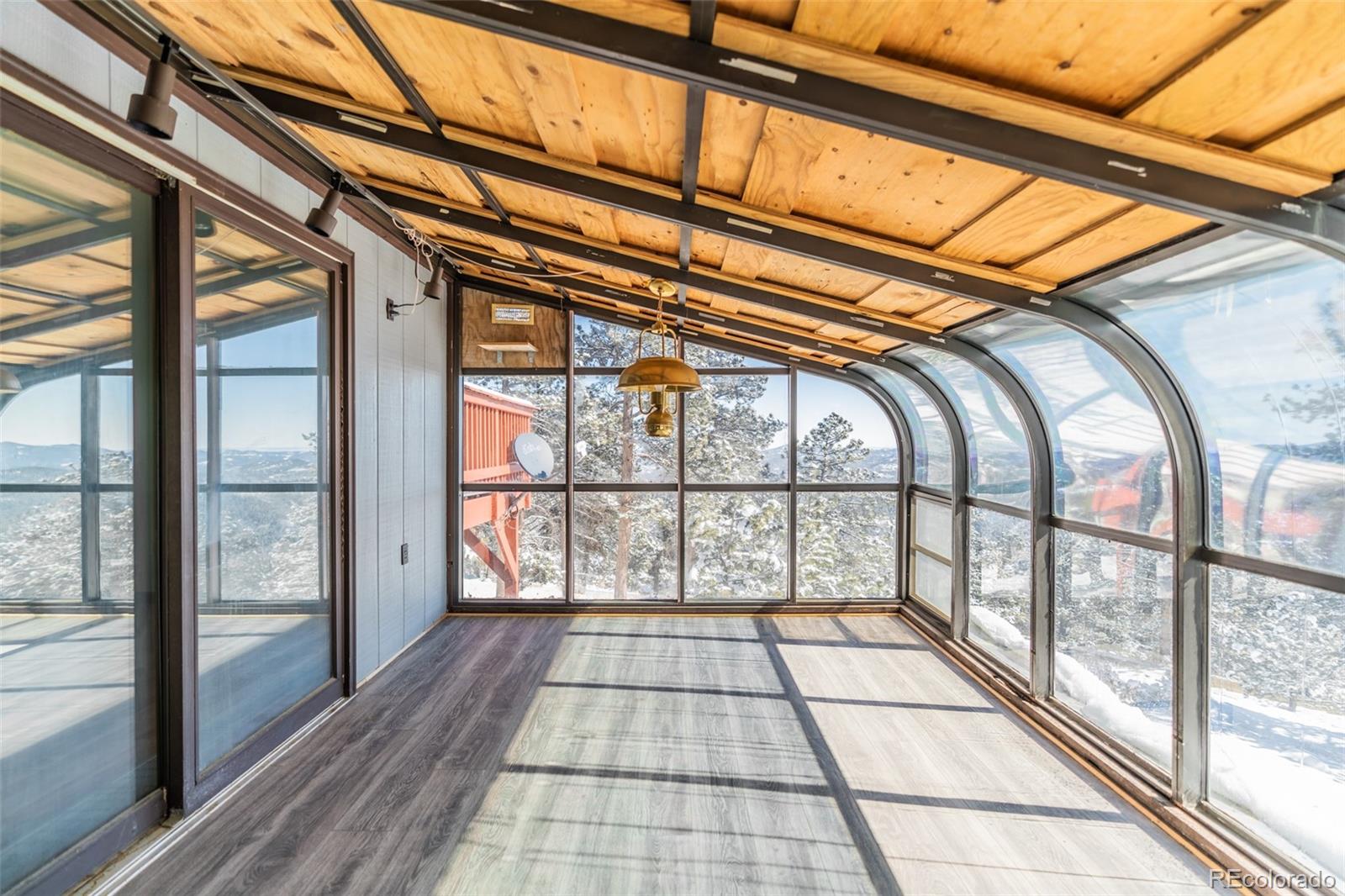 1189 Aspen Drive Evergreen, CO 80439 - Photo 14 of 37 a view of entryway with a floor and a window