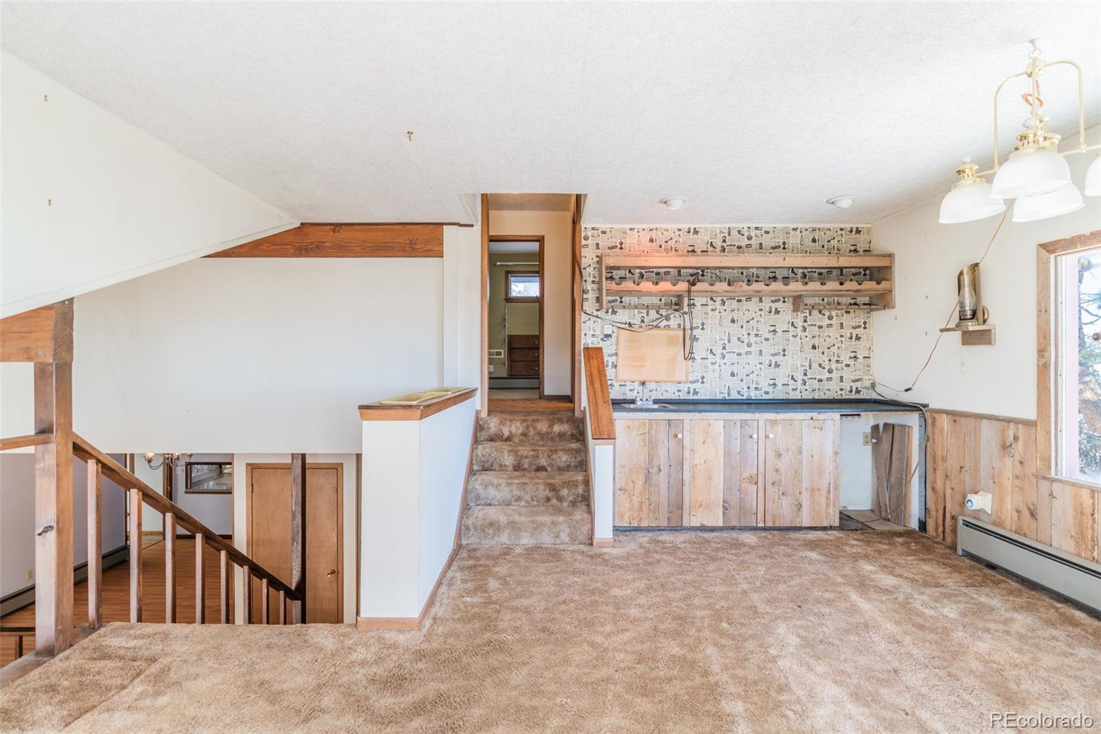 1189 Aspen Drive Evergreen, CO 80439 - Photo 18 of 37 a view of a hallway with seating area