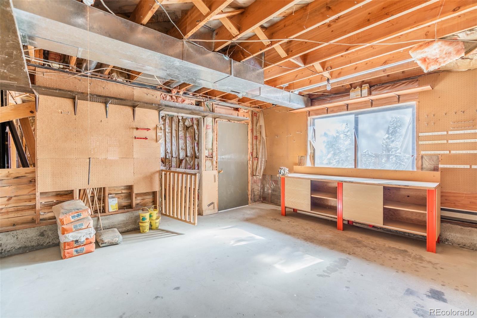 1189 Aspen Drive Evergreen, CO 80439 - Photo 28 of 37 a view of an empty room with a window