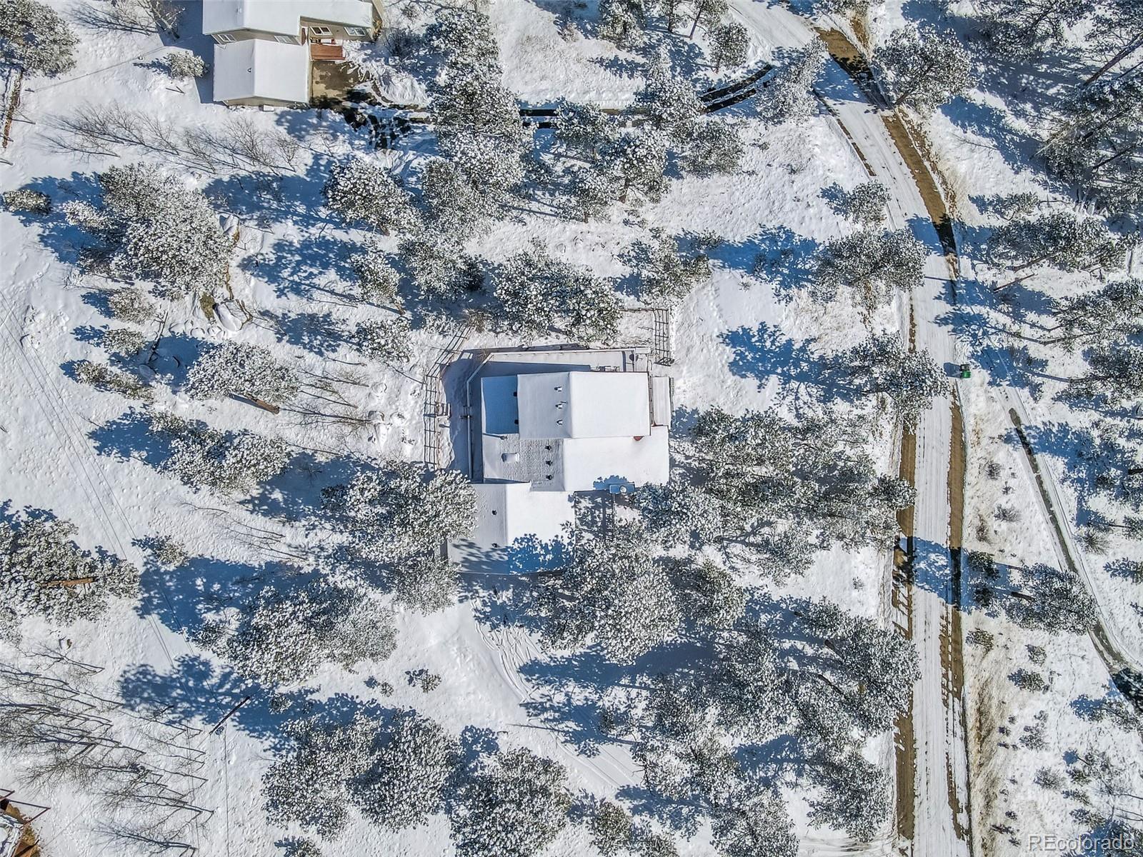 1189 Aspen Drive Evergreen, CO 80439 - Photo 35 of 37 a view of a house with a yard