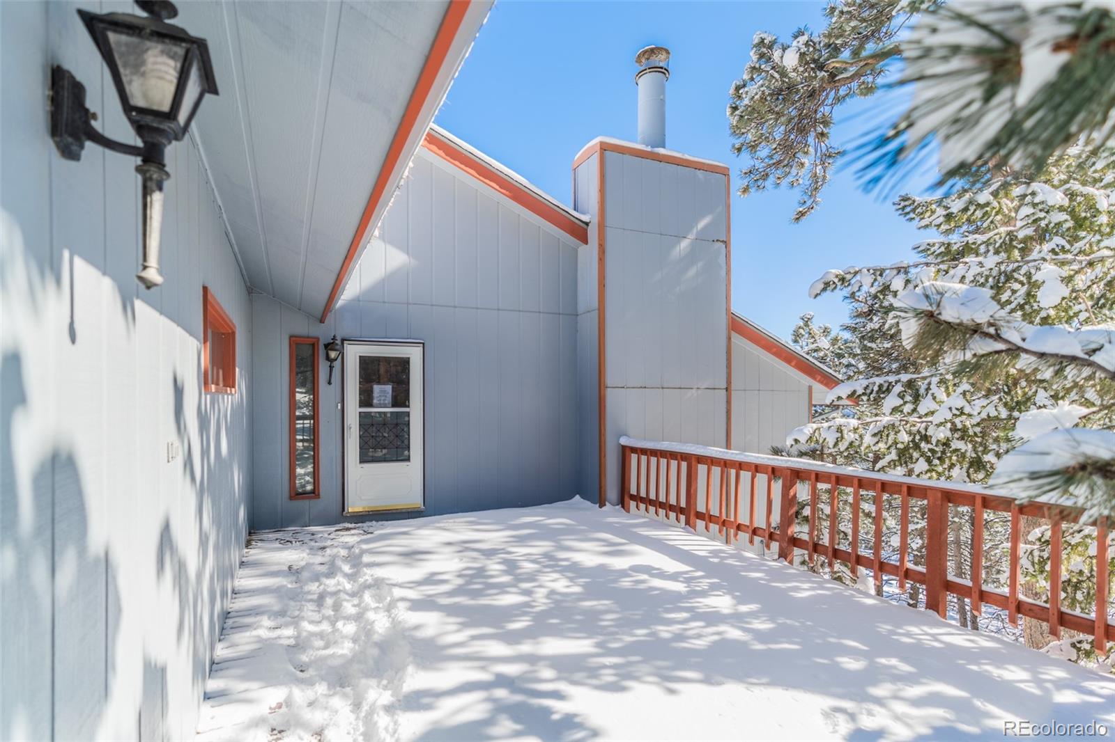 1189 Aspen Drive Evergreen, CO 80439 - Photo 4 of 37 a view of a house with a street