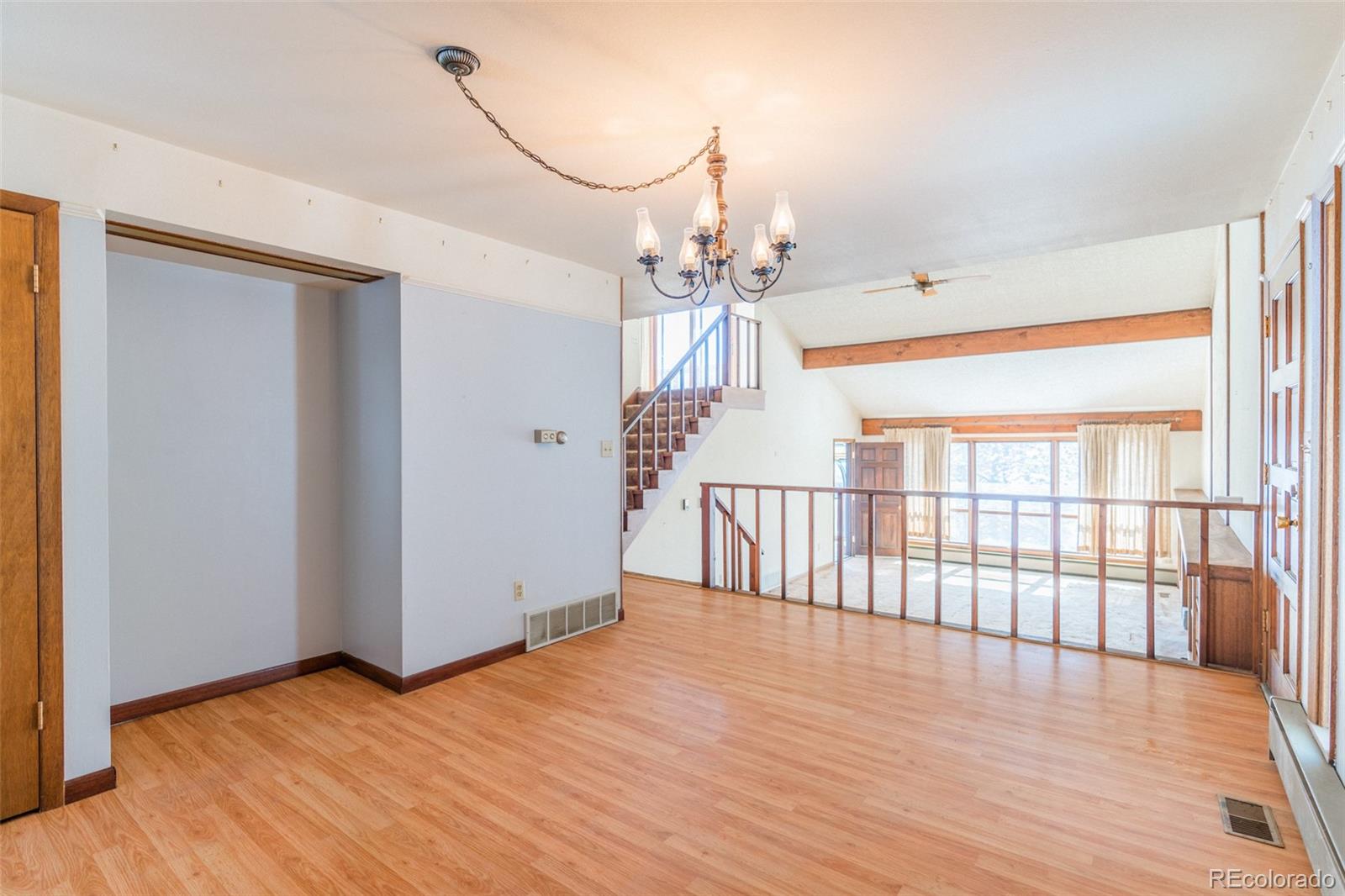 1189 Aspen Drive Evergreen, CO 80439 - Photo 6 of 37 wooden floor in an empty room with a window