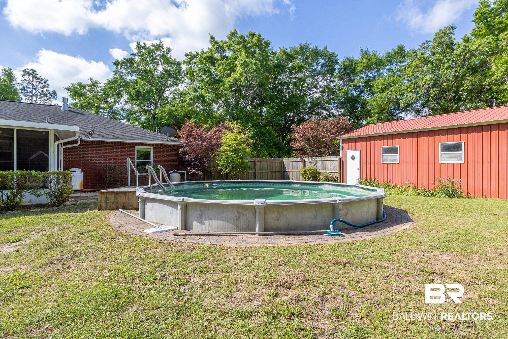 32345 River Lake Road Seminole, AL 36574 - Photo 44 of 56 View of pool with a fenced in pool, fence, and a lawn