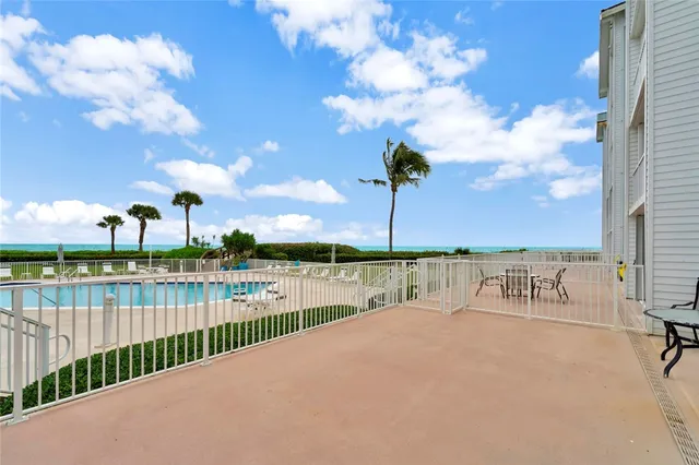 a view of a lake with a sitting area