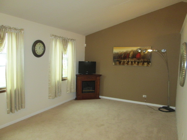 3456 Ronald Road Crete, IL 60417 - Photo 4 of 20 an empty room with windows and cabinet