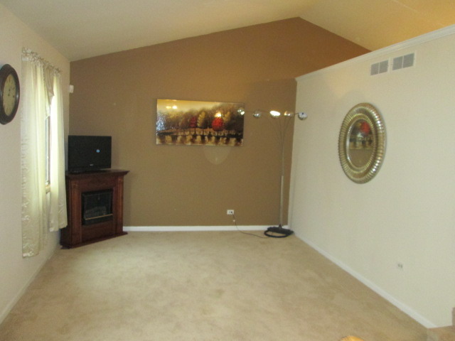 3456 Ronald Road Crete, IL 60417 - Photo 5 of 20 a view of a livingroom with furniture and a fan