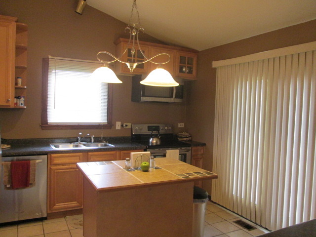 3456 Ronald Road Crete, IL 60417 - Photo 7 of 20 a bathroom with a sink and a mirror