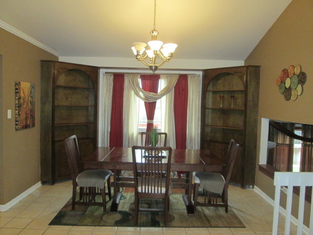 3456 Ronald Road Crete, IL 60417 - Photo 8 of 20 a view of a dining room with furniture and chandelier