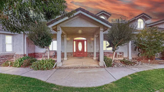 a very nice looking living room with a large window and furniture