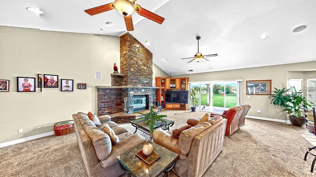 a kitchen with stainless steel appliances granite countertop a refrigerator and a stove