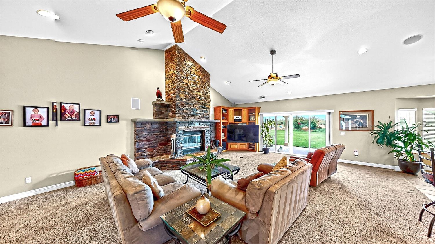 770 Merriam Road Hickman, CA 95323 - Photo 15 of 91 a living room with furniture a fireplace and a chandelier