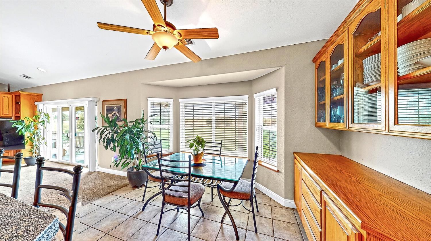 770 Merriam Road Hickman, CA 95323 - Photo 18 of 91 a dining room with furniture and floor to ceiling windows