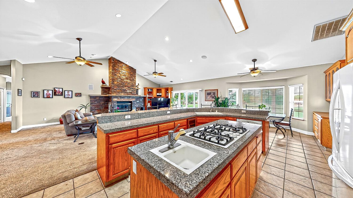770 Merriam Road Hickman, CA 95323 - Photo 21 of 91 a living room with furniture a table and kitchen view