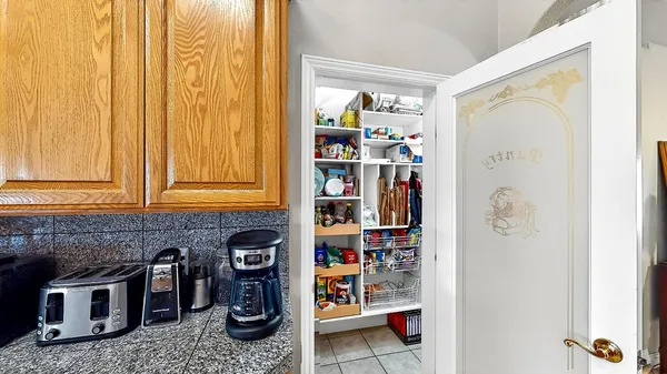 an outdoor living area with furniture and a fireplace