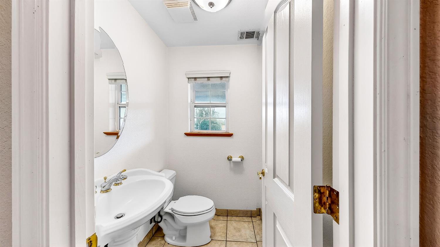 770 Merriam Road Hickman, CA 95323 - Photo 28 of 91 a bathroom with a granite countertop sink toilet and shower